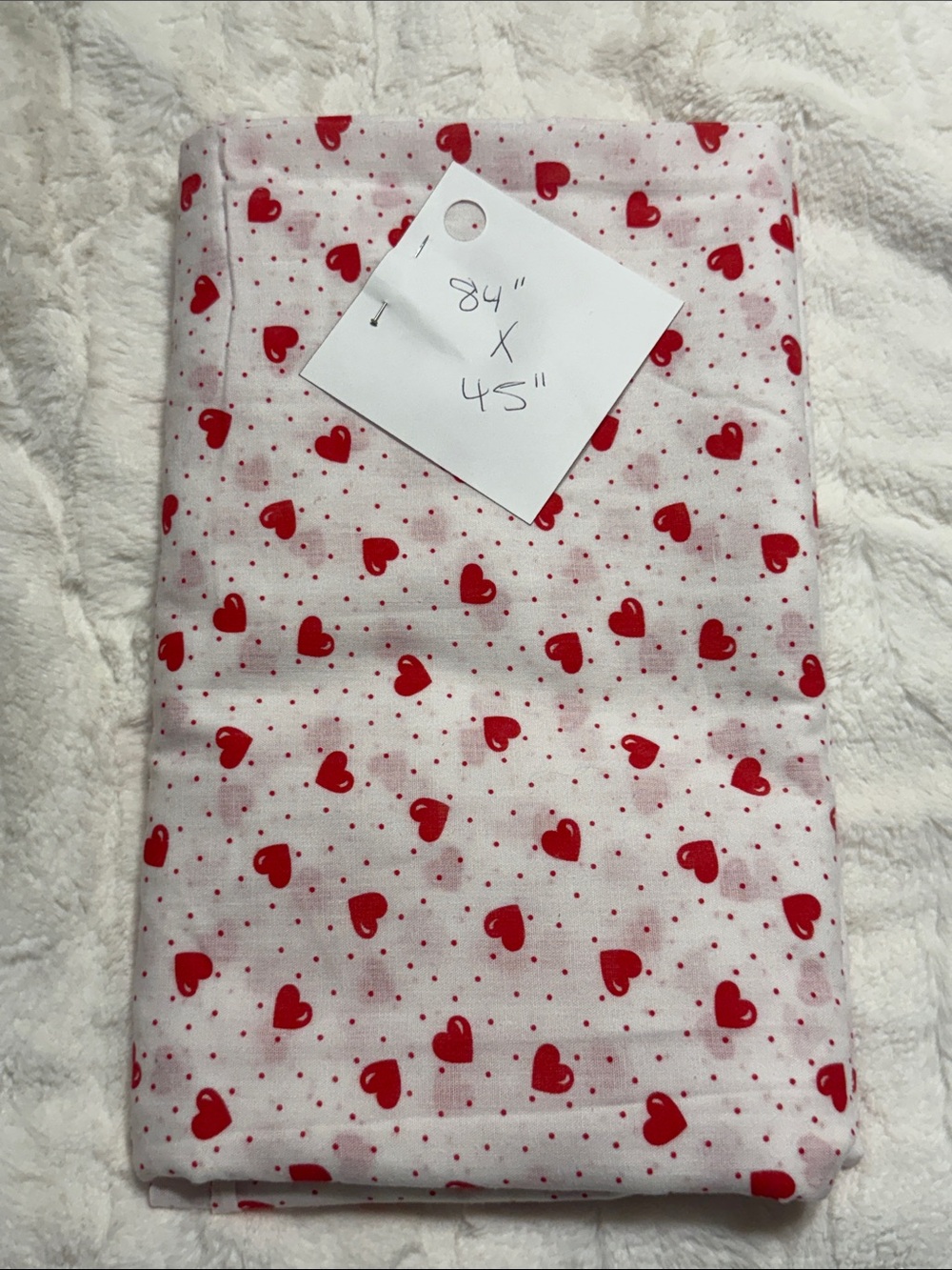 Fabric- lightweight white fabric with small red heart & dot pattern. 84” X 45”
